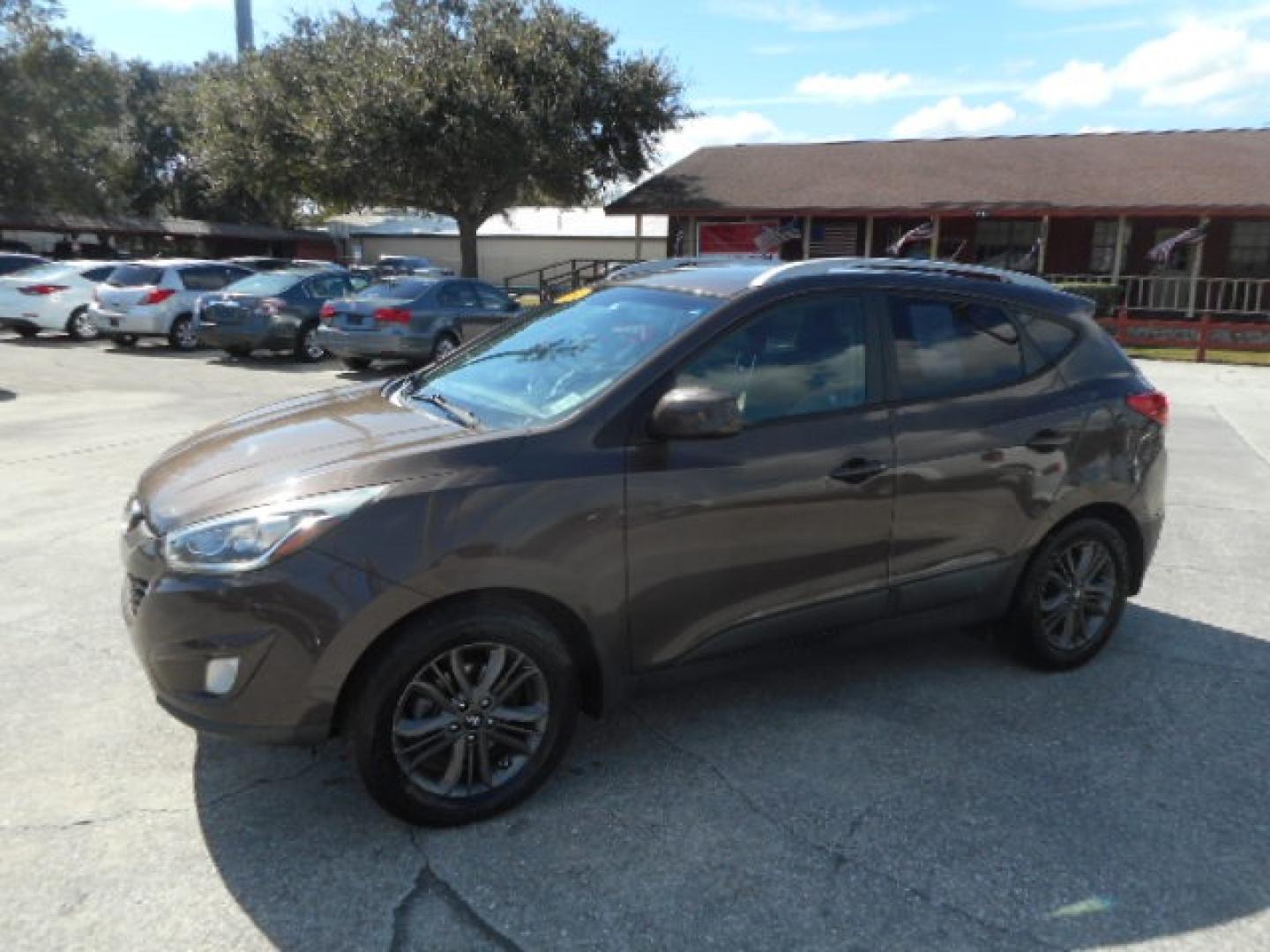 2014 BROWN HYUNDAI TUCSON LIMITED; SE (KM8JU3AG5EU) , located at 1200 Cassat Avenue, Jacksonville, FL, 32205, (904) 695-1885, 30.302404, -81.731033 - Photo#1