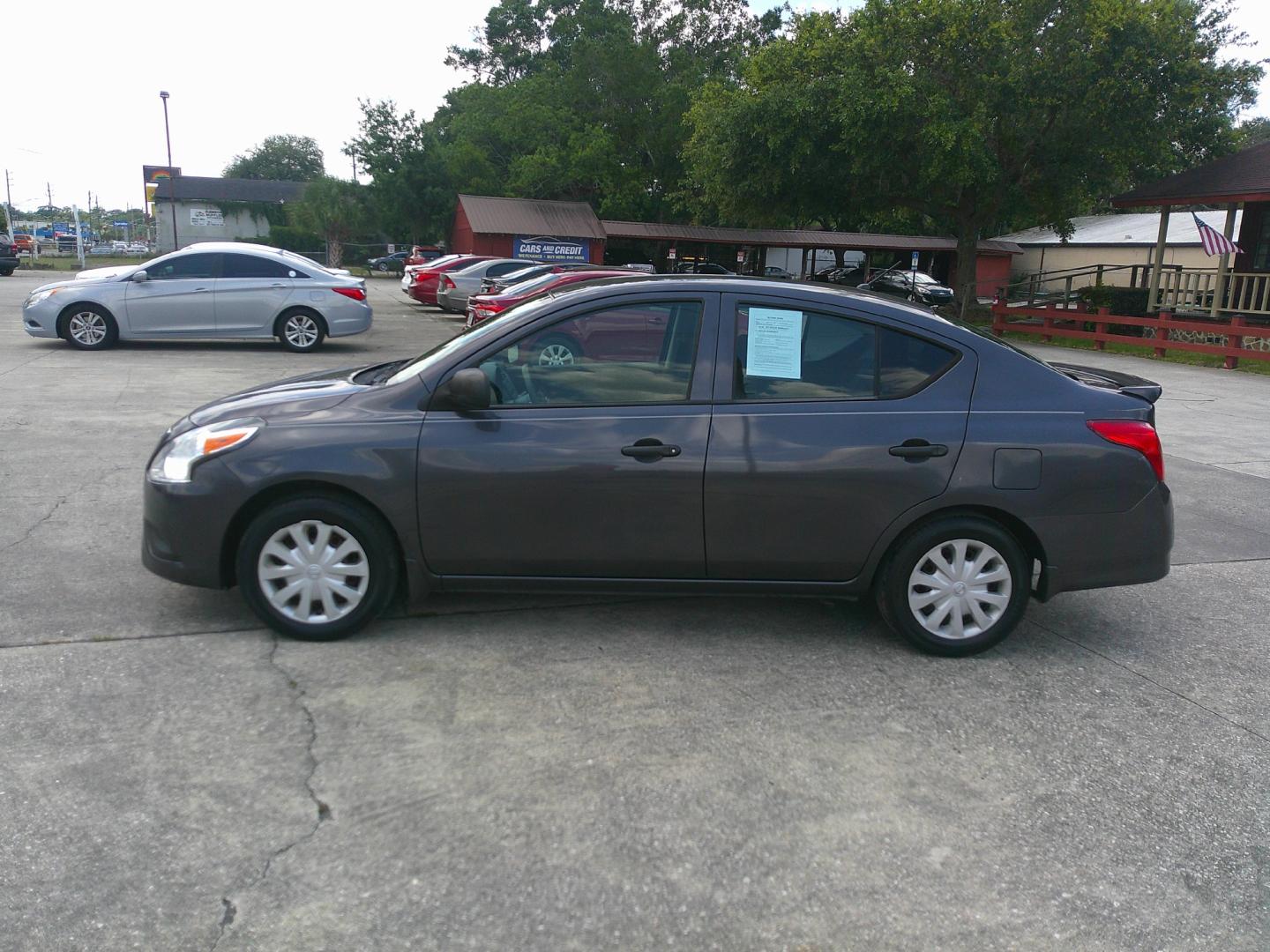 2015 GRAY NISSAN VERSA S; SL; SV (3N1CN7APXFL) , located at 10405 Abercorn Street, Savannah, GA, 31419, (912) 921-8965, 31.988262, -81.131760 - Photo#1