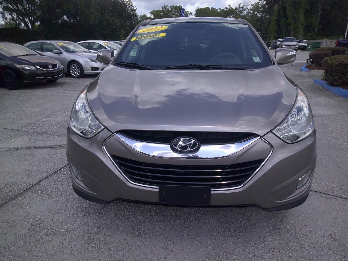 2012 GOLD HYUNDAI TUCSON GLS; LIMITED (KM8JUCAC1CU) , located at 390 Hansen Avenue, Orange Park, FL, 32065, (904) 276-7933, 30.130497, -81.787529 - Photo#0