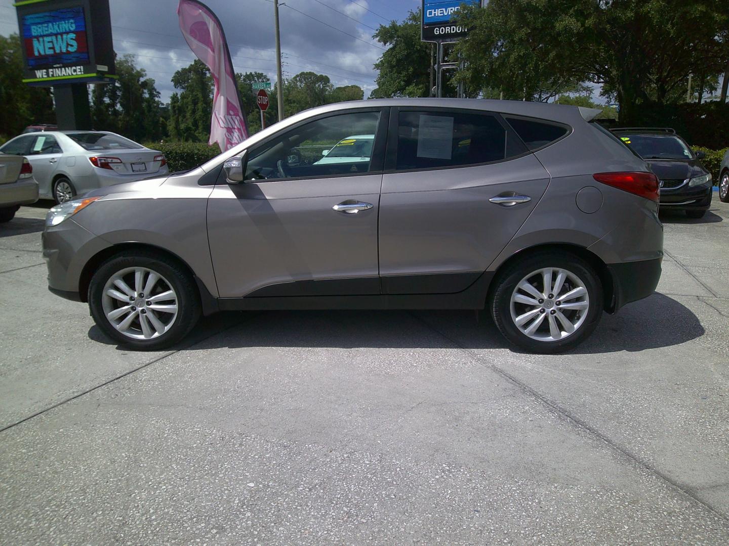 2012 GOLD HYUNDAI TUCSON GLS; LIMITED (KM8JUCAC1CU) , located at 390 Hansen Avenue, Orange Park, FL, 32065, (904) 276-7933, 30.130497, -81.787529 - Photo#4